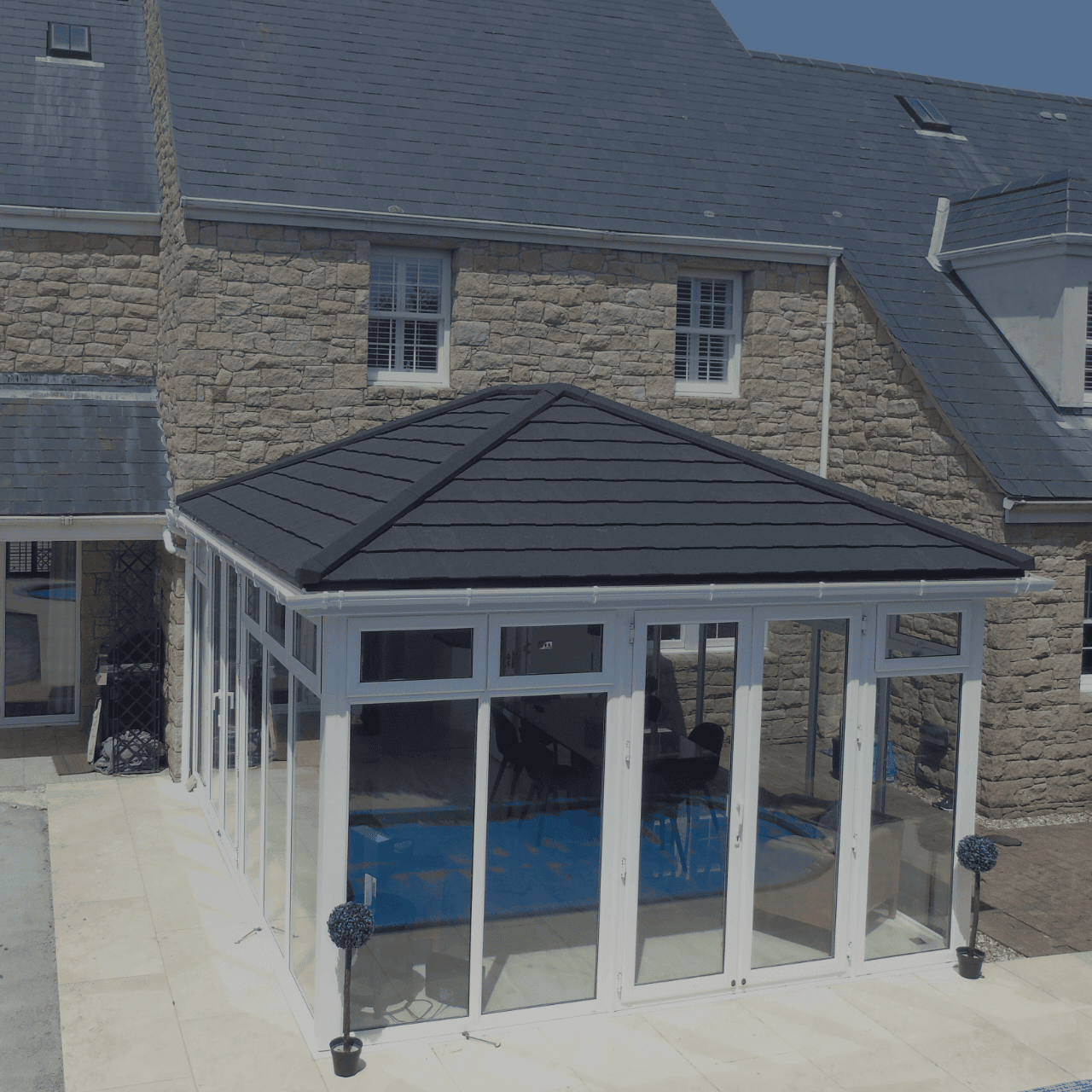 SupaLite tiled roof conservatory attached to a granite house